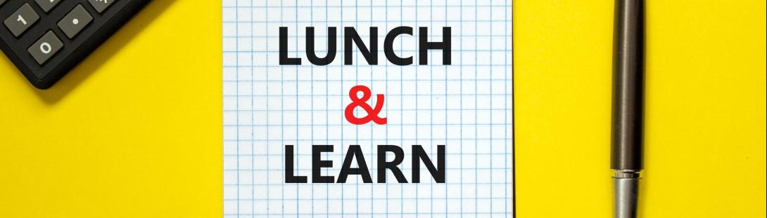 notebook stating "lunch and learn" next to a pen - links to Lunch & Learn page