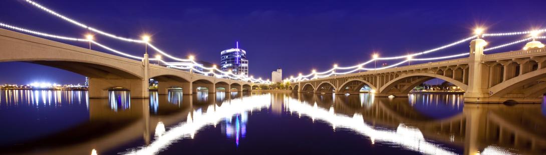 Tempe Town Lake Bridge at night while the bridge is lit