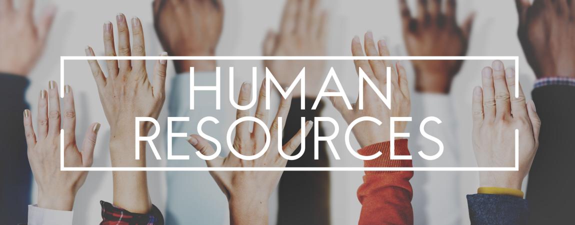 Hands up against a wall with the the words "Human Resources" overlayed