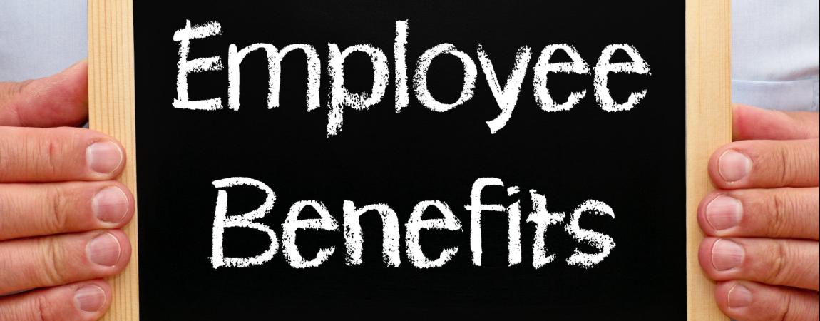 chalk board stating Employee Benefits